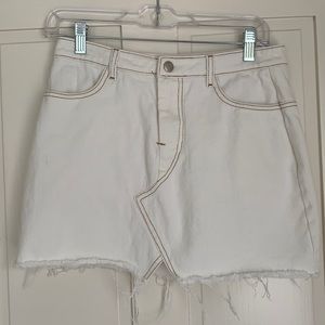 White jean skirt with brown/burnt orange stitching